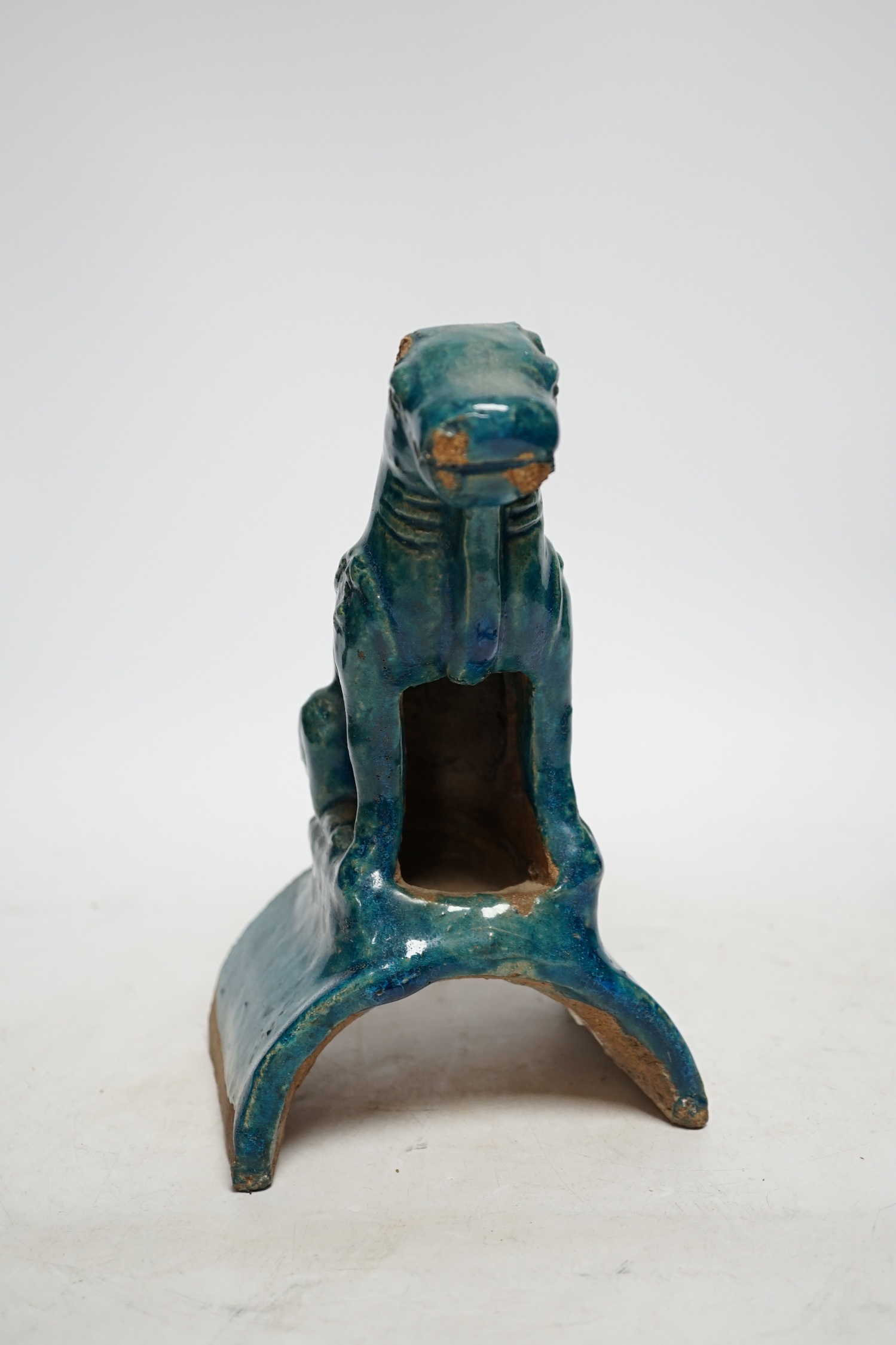 A Chinese turquoise glazed lion-dog ridge tile, Ming dynasty, 22cm high